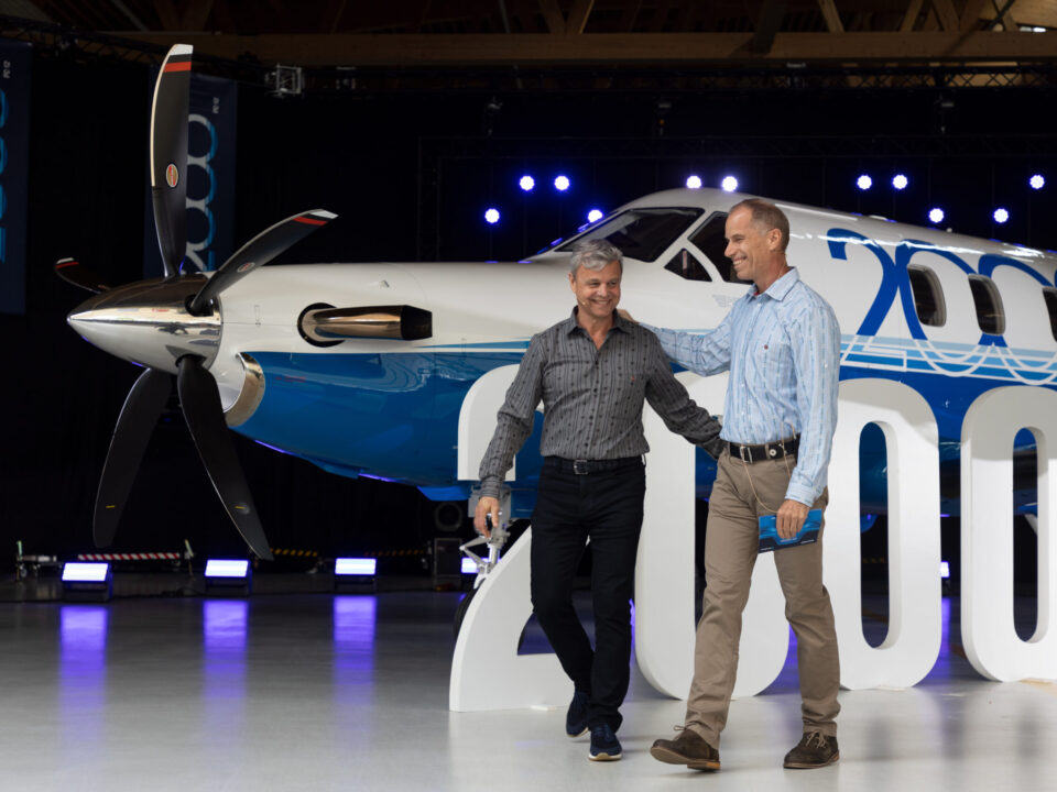 2 Men in front of PlaneSense Jet